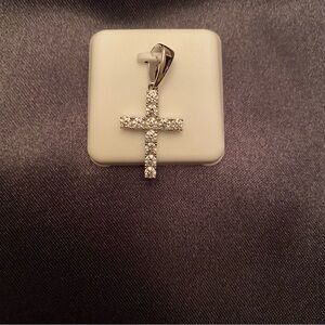 Stunning cross pendant with Moissanite gemstones.